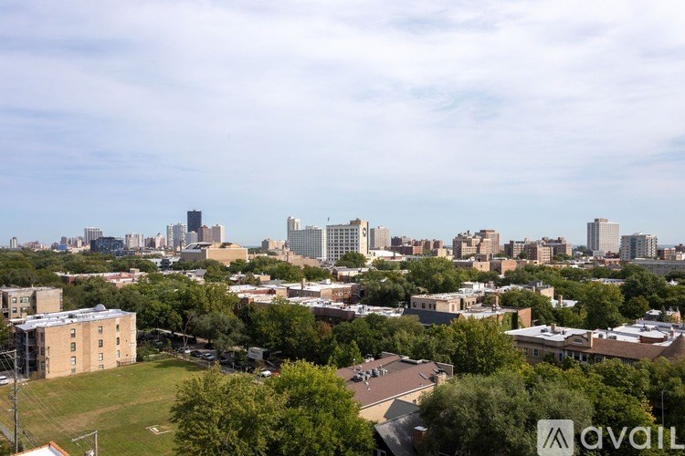 A cityscape with buildings and trees in the foreground.