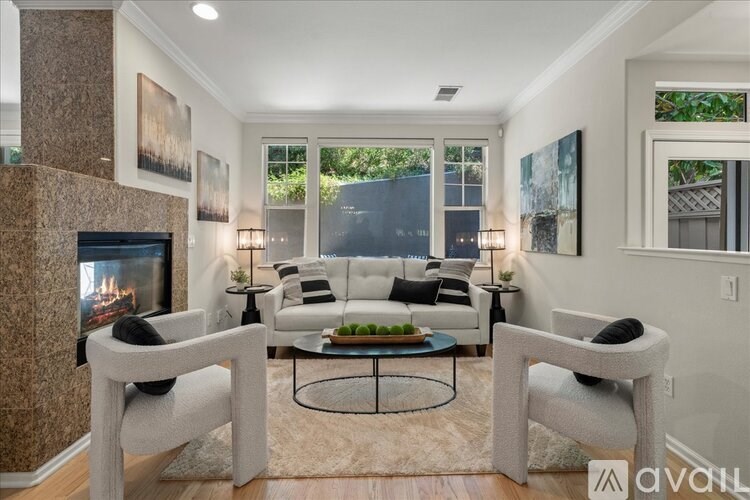 A living room with a fireplace and a couch.