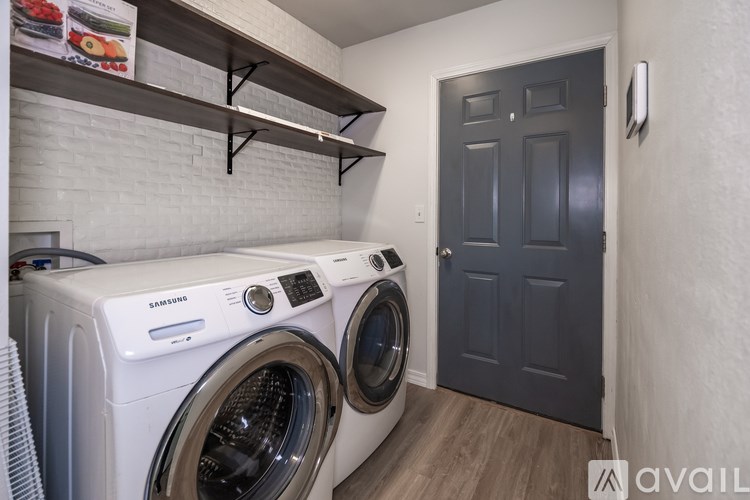 A laundry room with a washer and dryer.