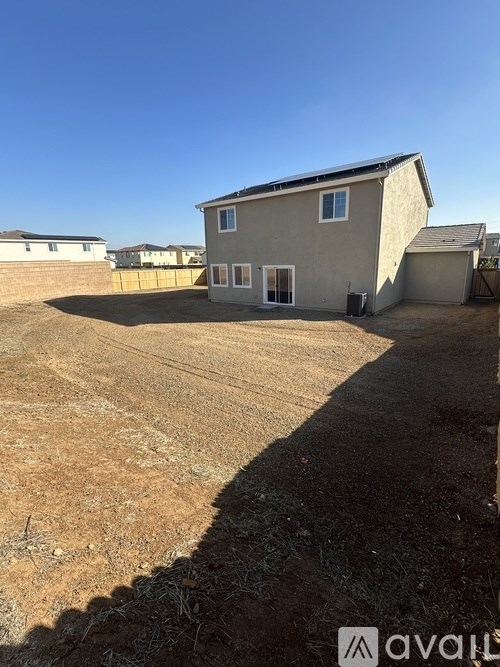 A house with a garage is for sale.