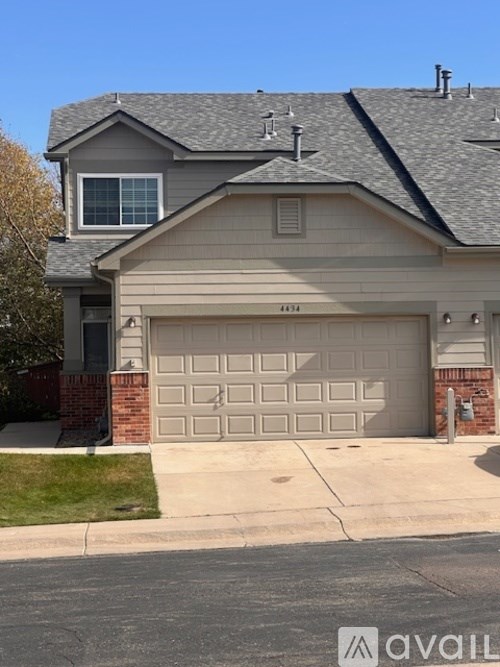 A two-car garage is attached to a house.