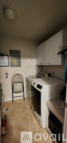 A kitchen with white appliances and a white oven.