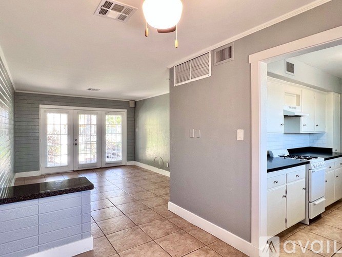A kitchen with a counter and cabinets is shown.