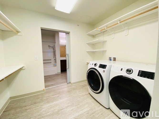 A laundry room with a washer and dryer.