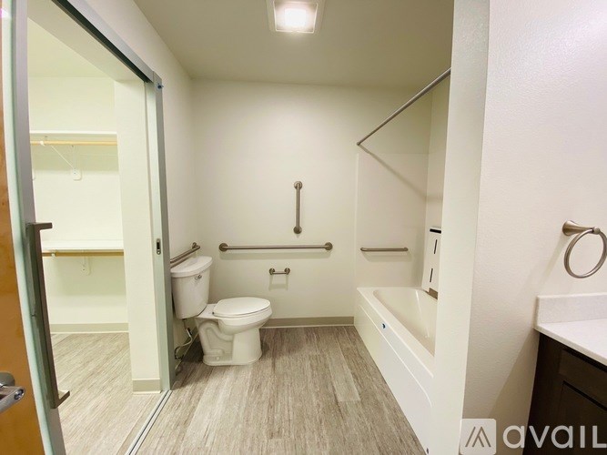 A bathroom with a toilet, sink, and bathtub.