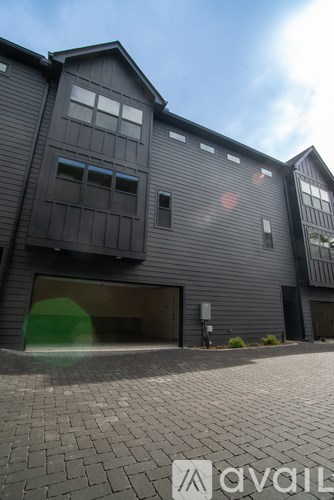 A modern house with a garage and a driveway.