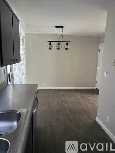 A kitchen with a sink and a counter.