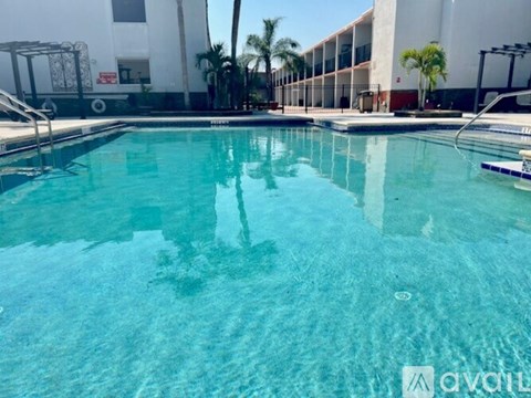 A swimming pool with a reflection of a person in the water.