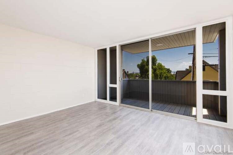 A room with a sliding door and a view of the outside.
