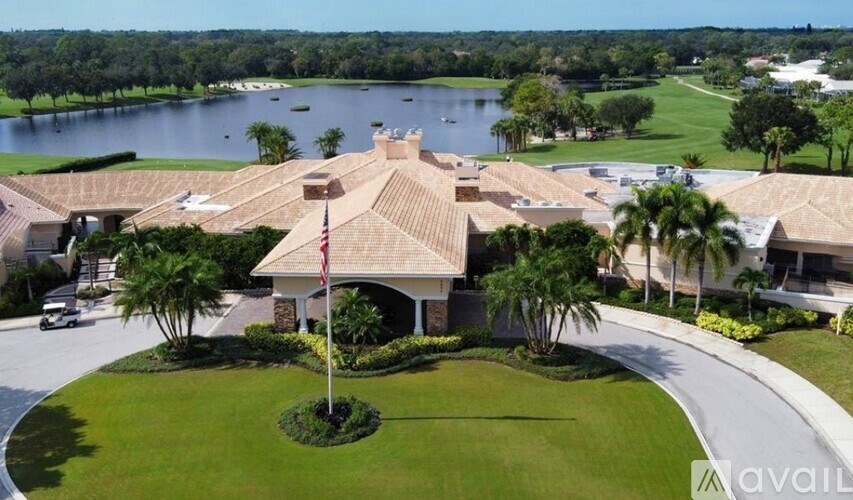 A house with a flag on a pole in front of it.