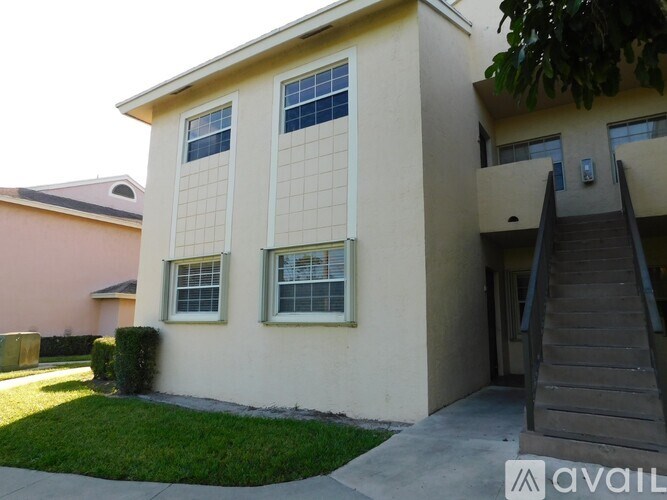 A two-story house with a staircase leading to the second floor.