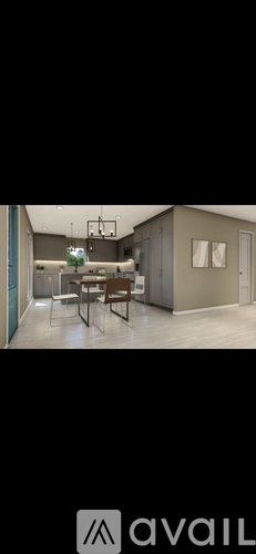 A kitchen with a dining table and chairs.