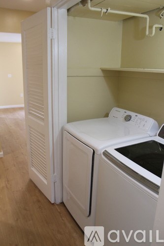 A white dishwasher and dryer are available for use.