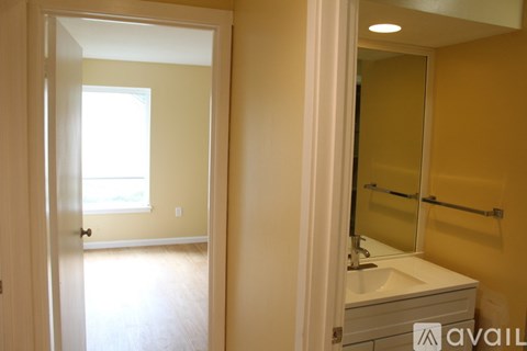A bathroom with a sink and mirror.
