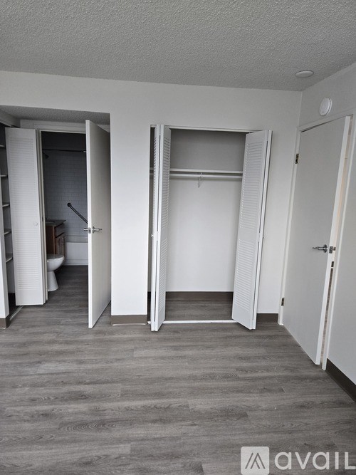 A room with a white door and a white wall.