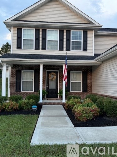 A house with a flag on the porch.