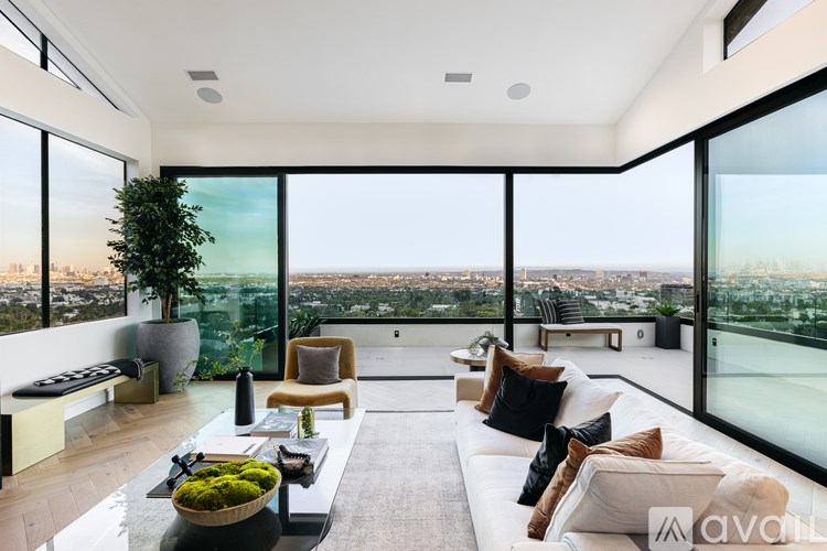 A modern living room with a view of the city.