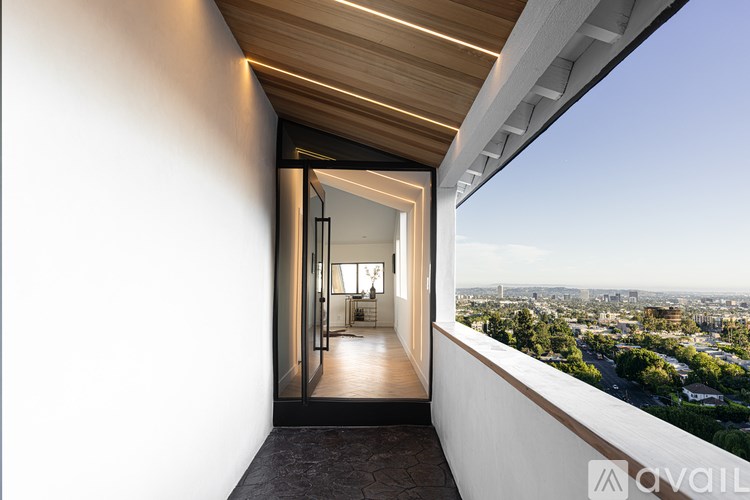 A modern interior space with a view of the cityscape outside.