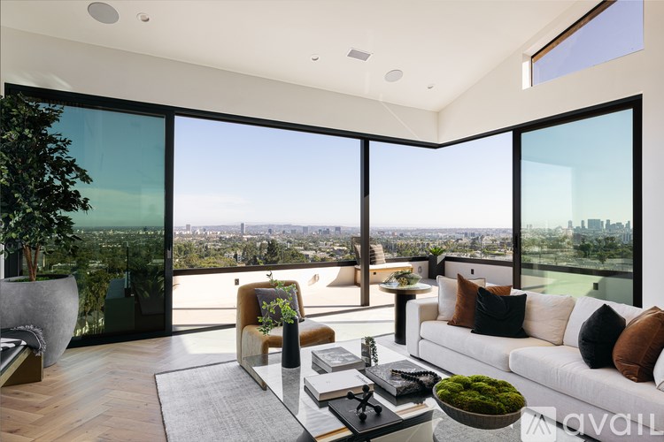 A modern living room with a view of the city.