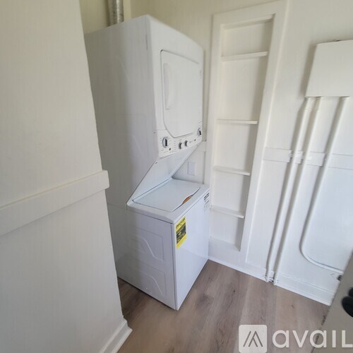A white fridge and freezer in a room.