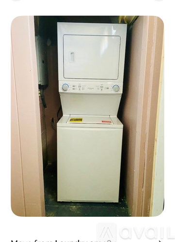 A white appliance with a control panel and a yellow sticker on the front.