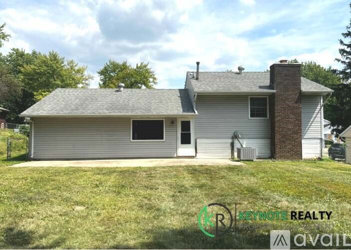 A house with a garage is for sale.