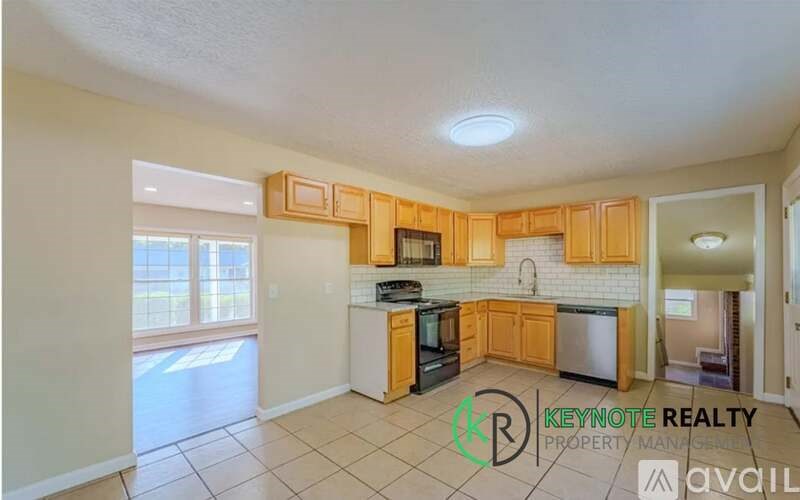 A kitchen with wooden cabinets and a stove top oven.