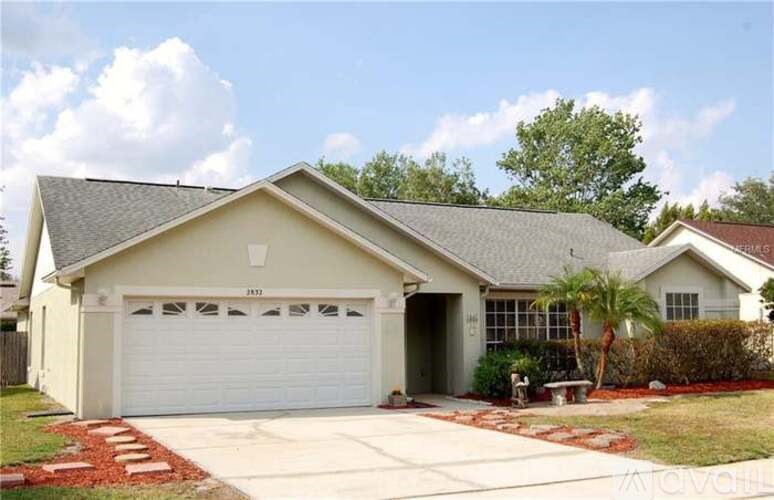 A two-car garage is attached to a house.