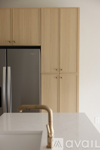 A kitchen with a sink and cabinets.