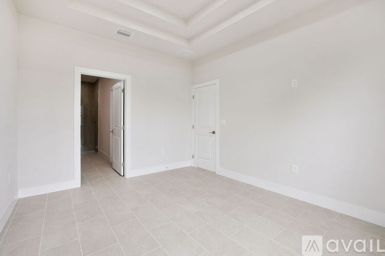 A room with a doorway leading to another room.