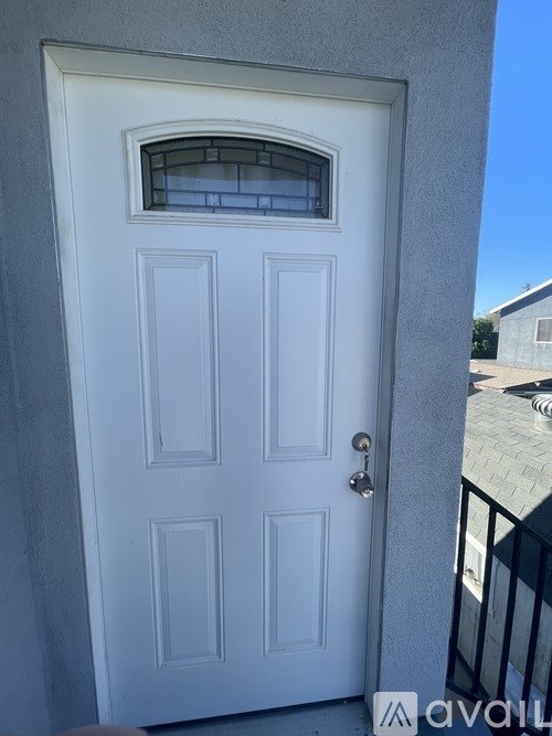 A white door with a glass window above the main door.