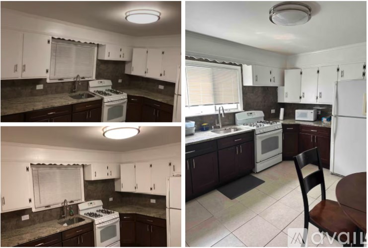 A kitchen with white appliances and dark cabinets.