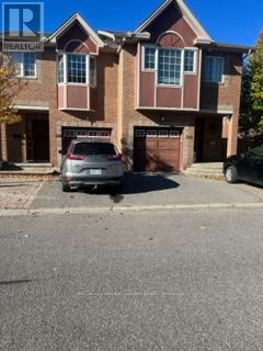 A house with a car parked in front of it.