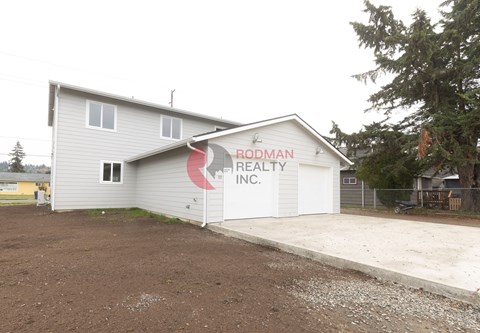 A building with the sign "Rodman Realty Inc." on it.