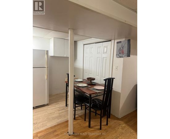 A dining room with a table set for two.