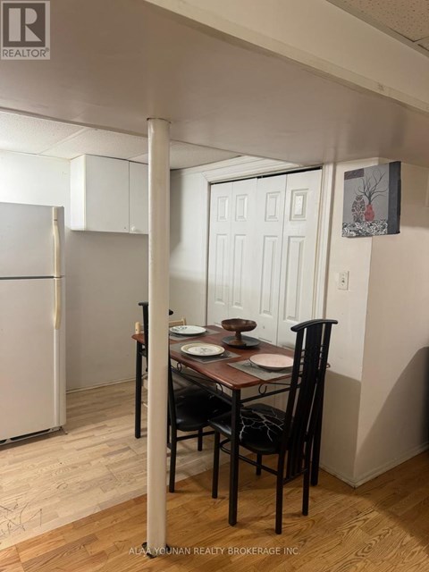 A dining room with a table set for two.