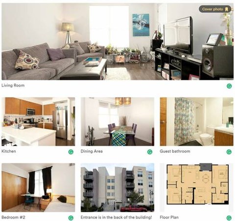 A living room with a grey couch and a coffee table.