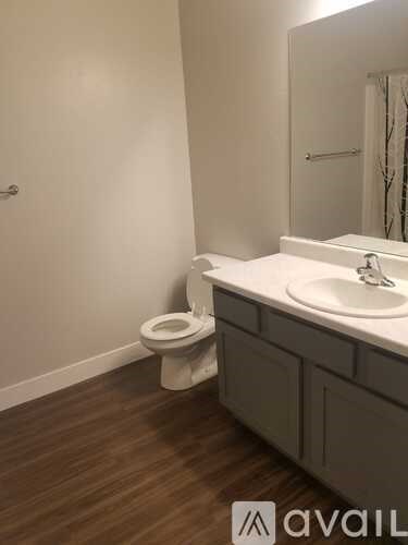 A bathroom with a toilet and sink.