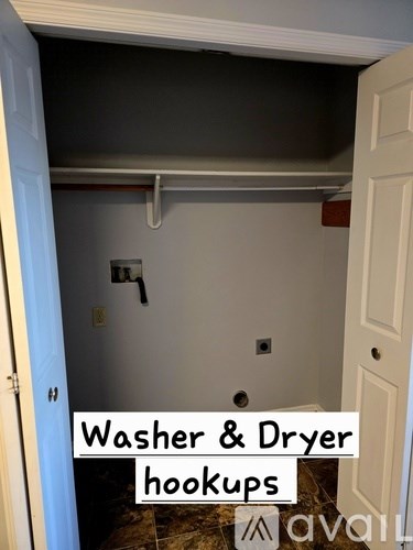 A room with a washer and dryer hookup.