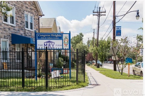 The entrance to the May Firm Arts and Culture Center is gated and well-maintained.