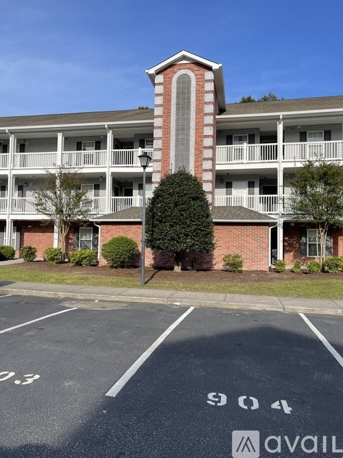 A parking lot with the number 904 painted on the pavement.