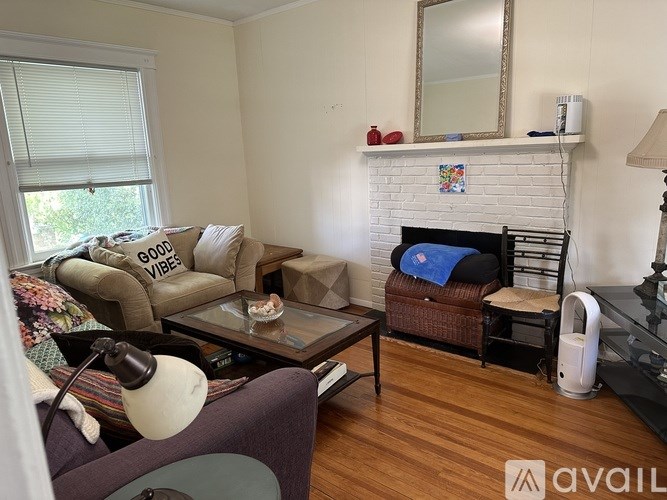 A living room with a couch, chair, and coffee table.