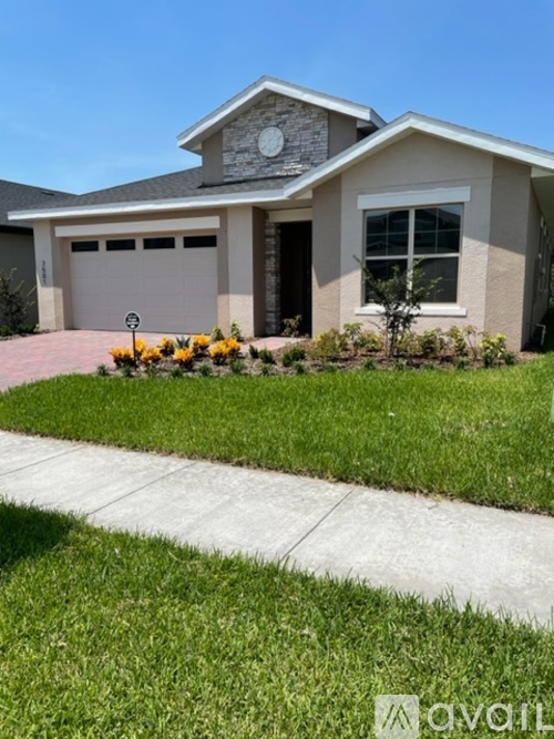 A house with a garage and a driveway.