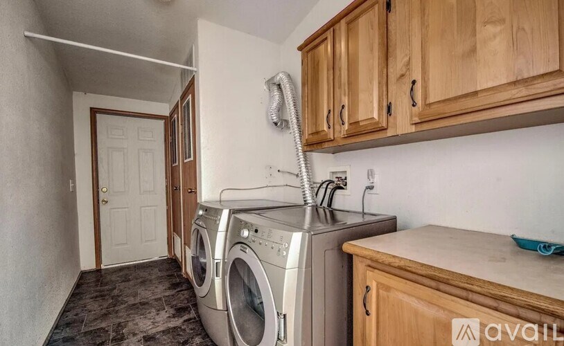 A laundry room with a washer and dryer.