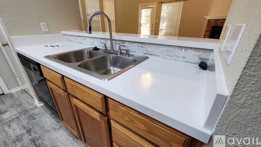 A kitchen with a sink and a countertop.
