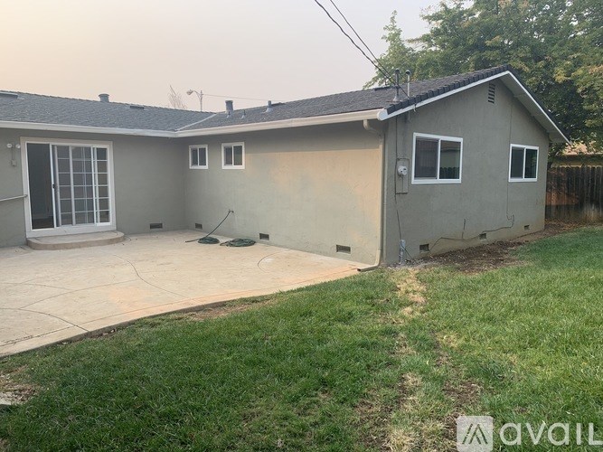 A house with a garage and a driveway.