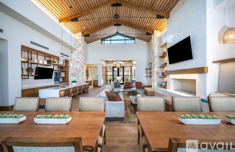 A large dining room with a long table and chairs.