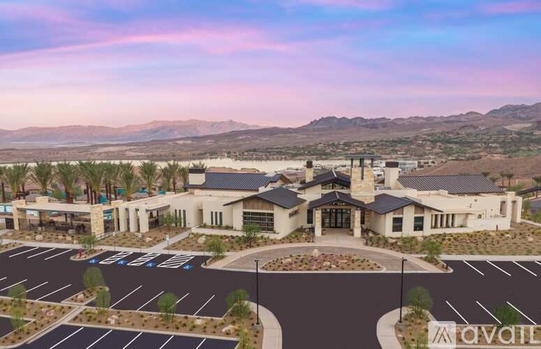 A large building with a parking lot in front of it.