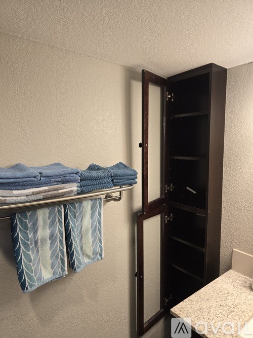 Towels are hanging on a rack in a room.