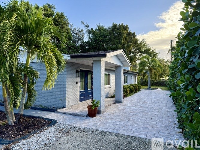A house with a blue door and a small porch.